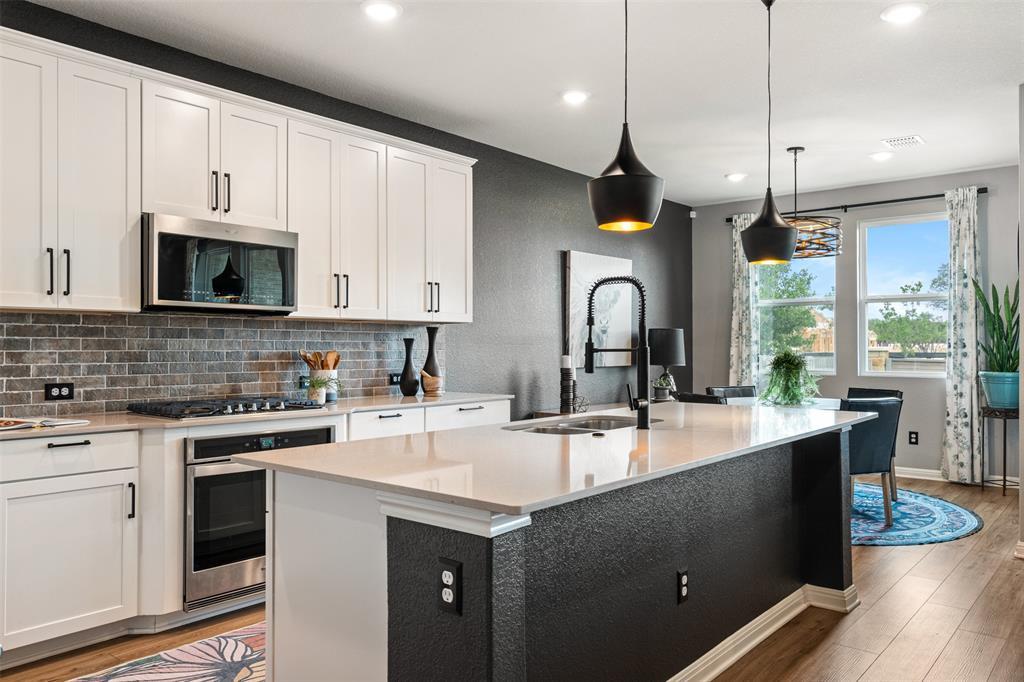 Culinary delights await in this modern kitchen wi