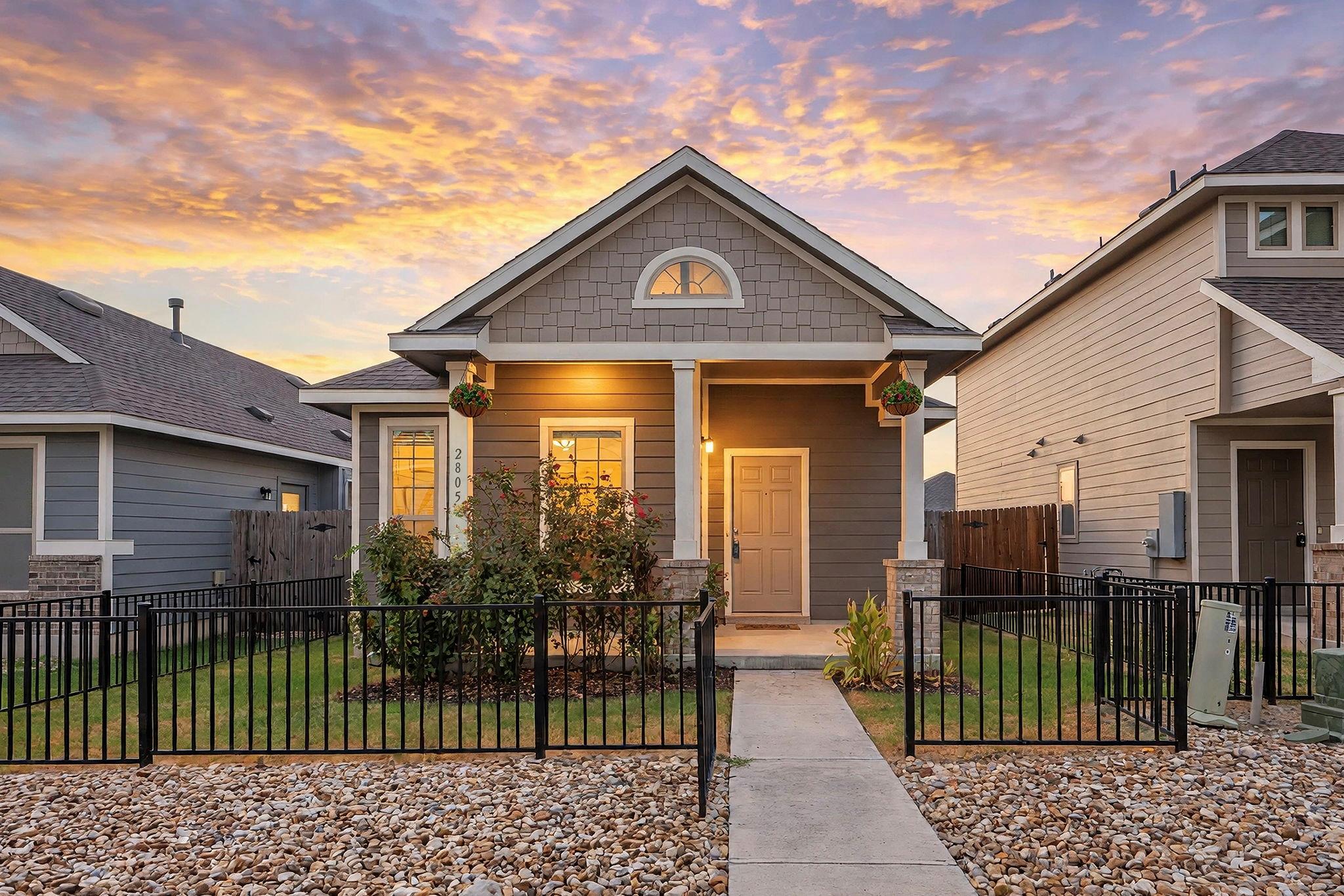 A welcoming front porch and manicured front yard 
