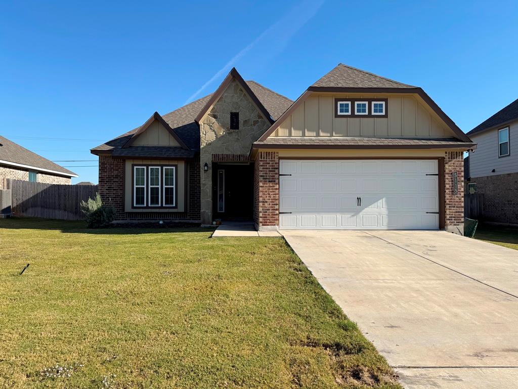 Craftsman inspired home featuring roof with shing