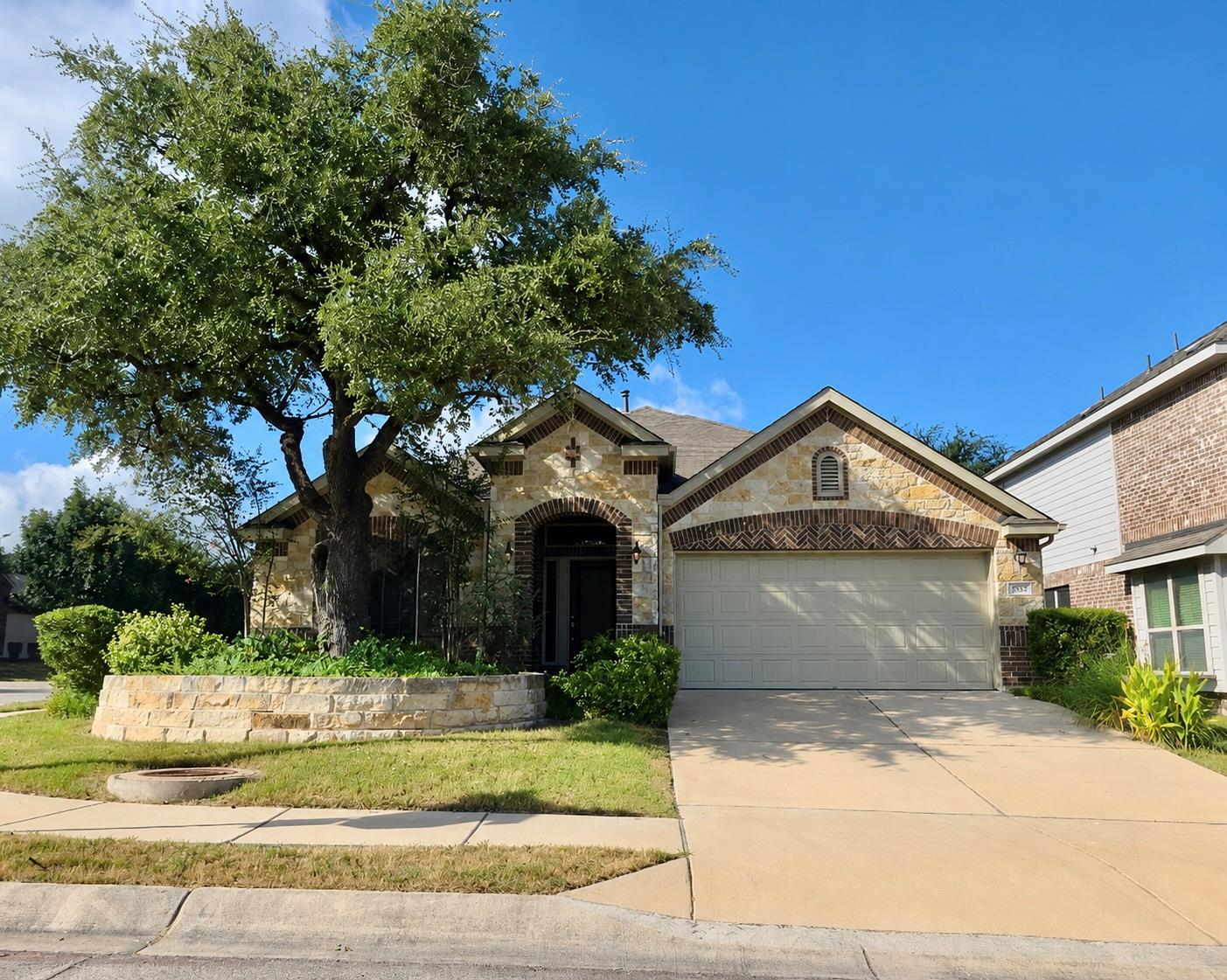 Natural stone masonry and a classic gabled roofli
