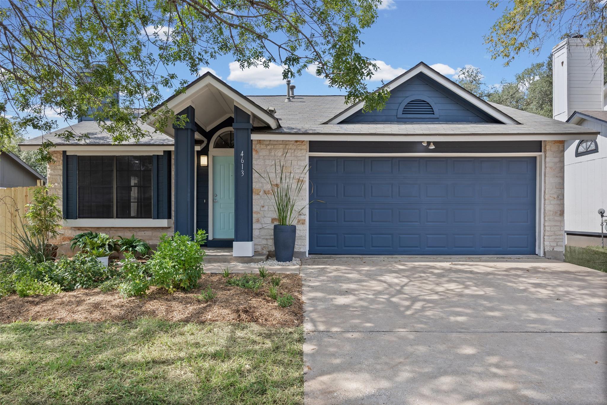 Clean lines and a spacious driveway define this w