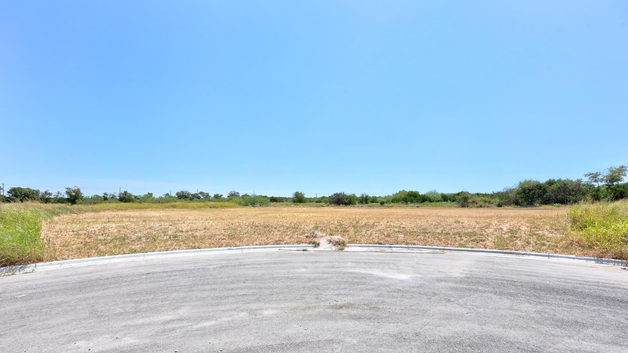 A cleared building site sits at the end of a quie