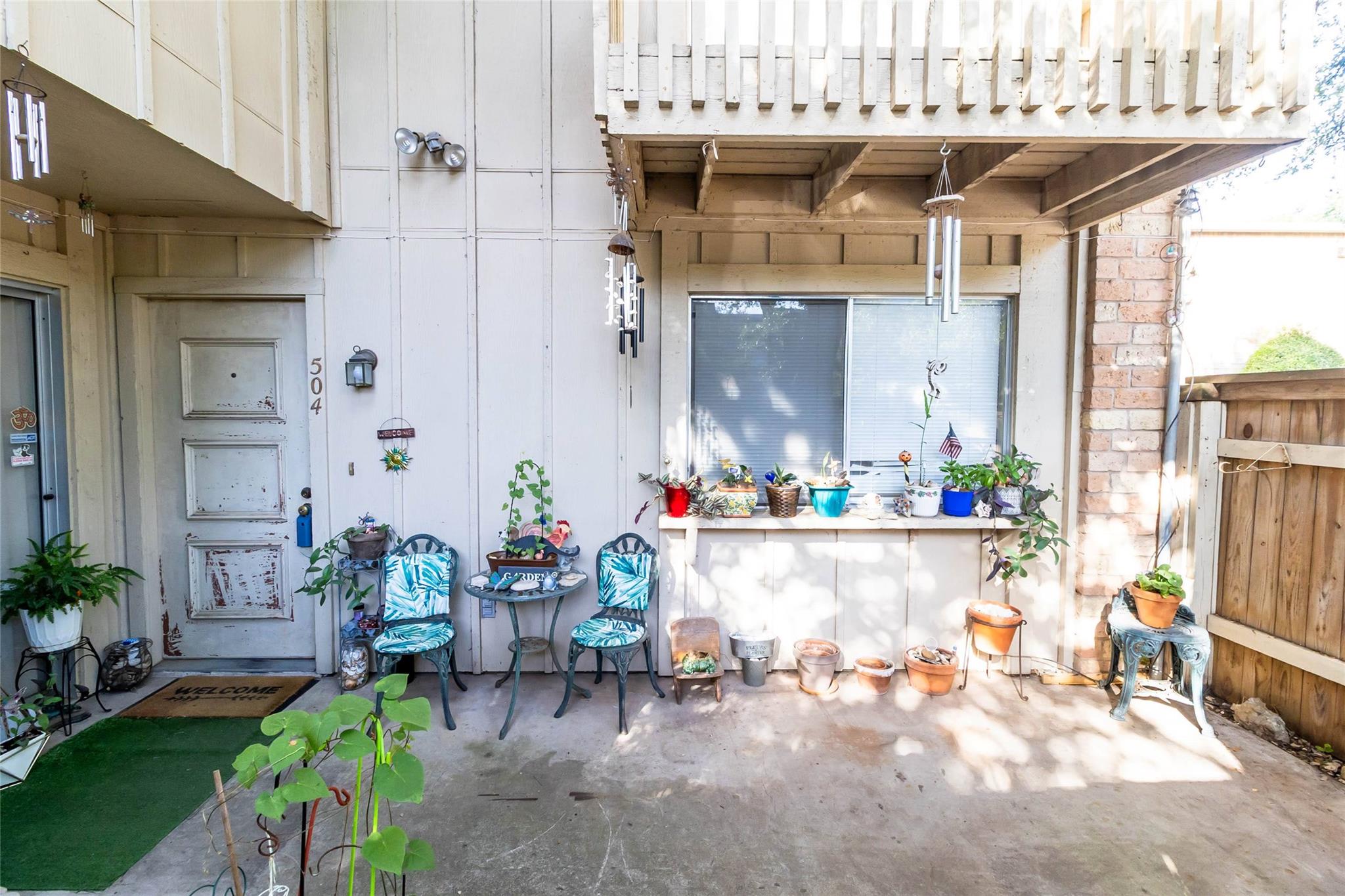 An inviting concrete patio offers a private outdo