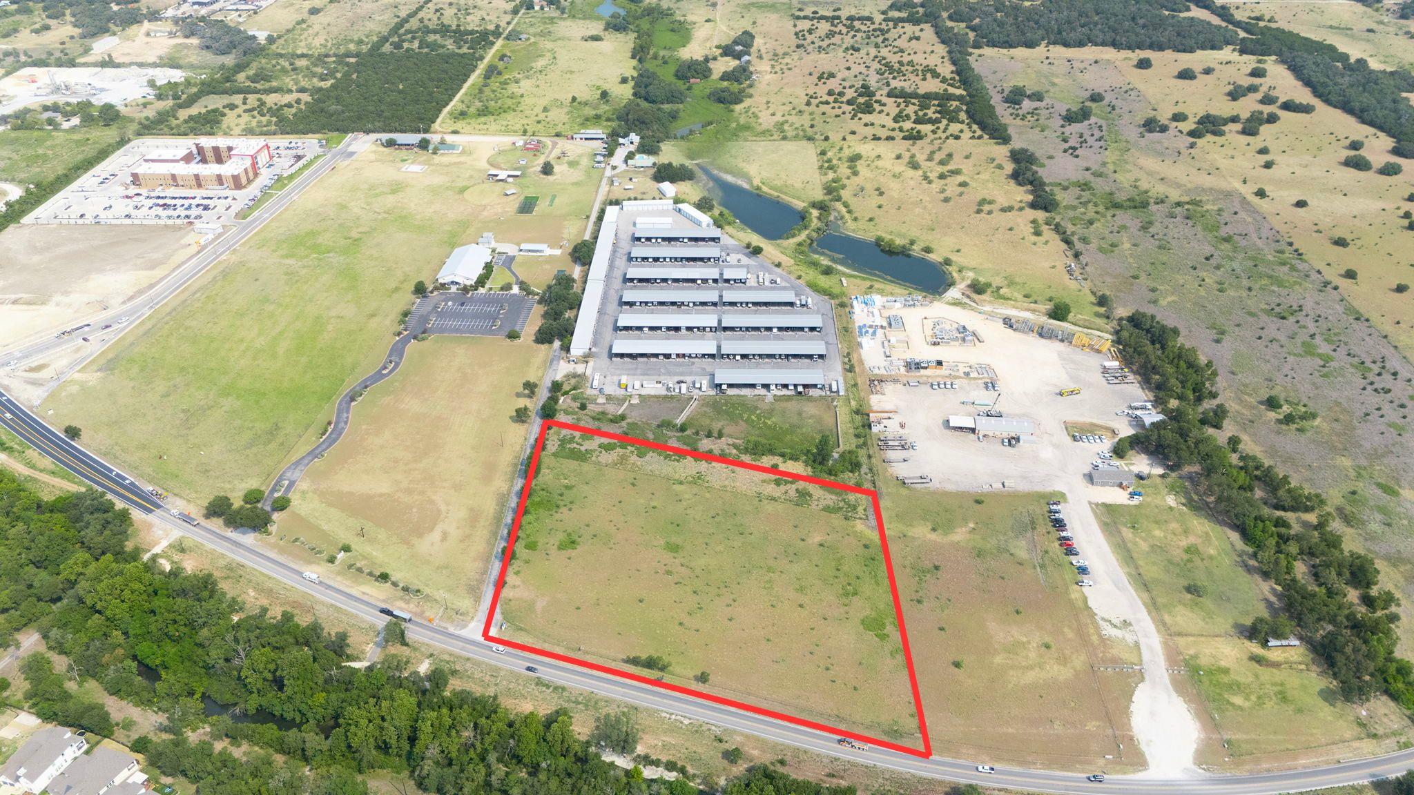 A spacious, open development site boasts prime ro