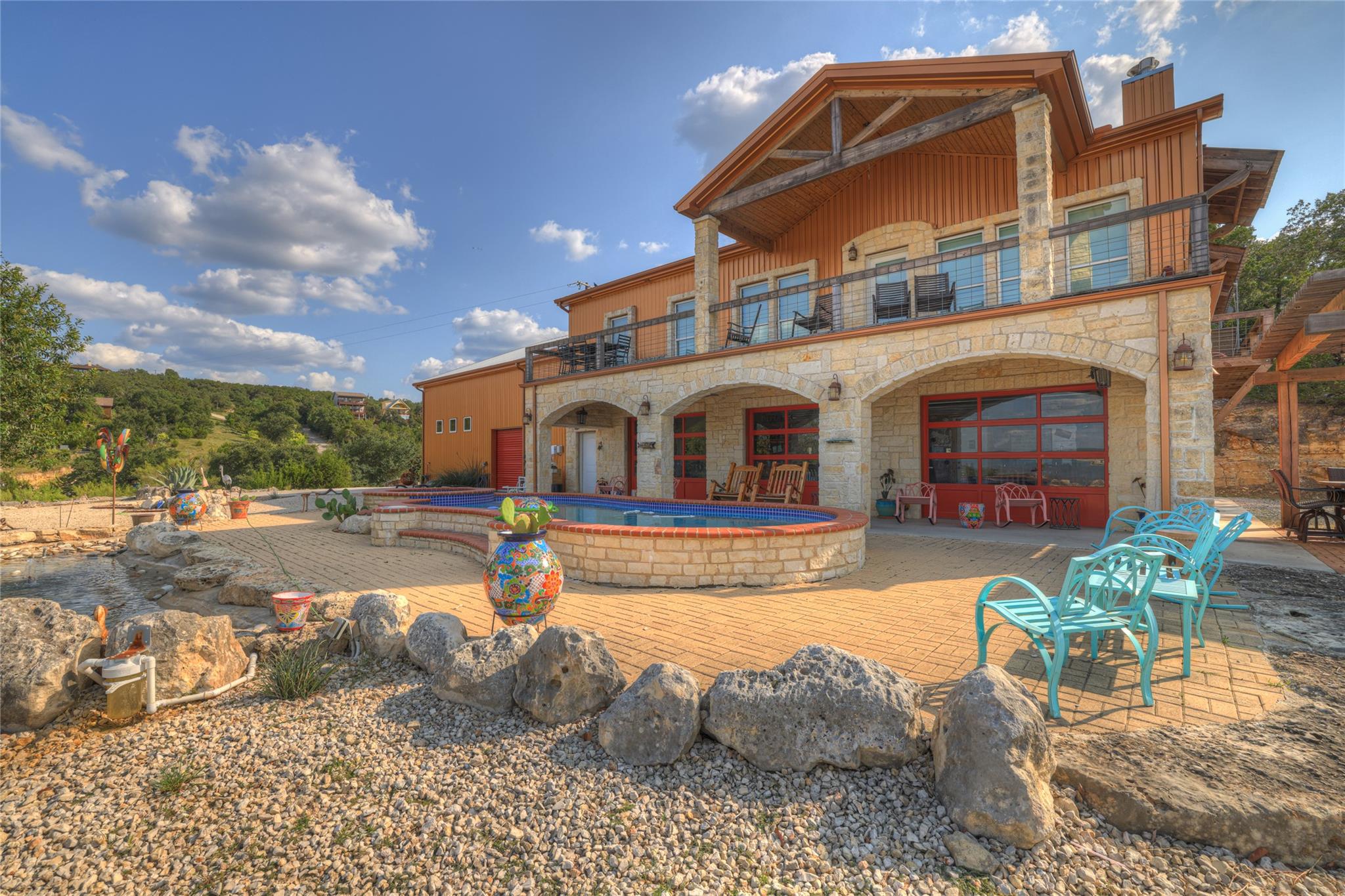 Stone arches and a spacious patio frame the spark