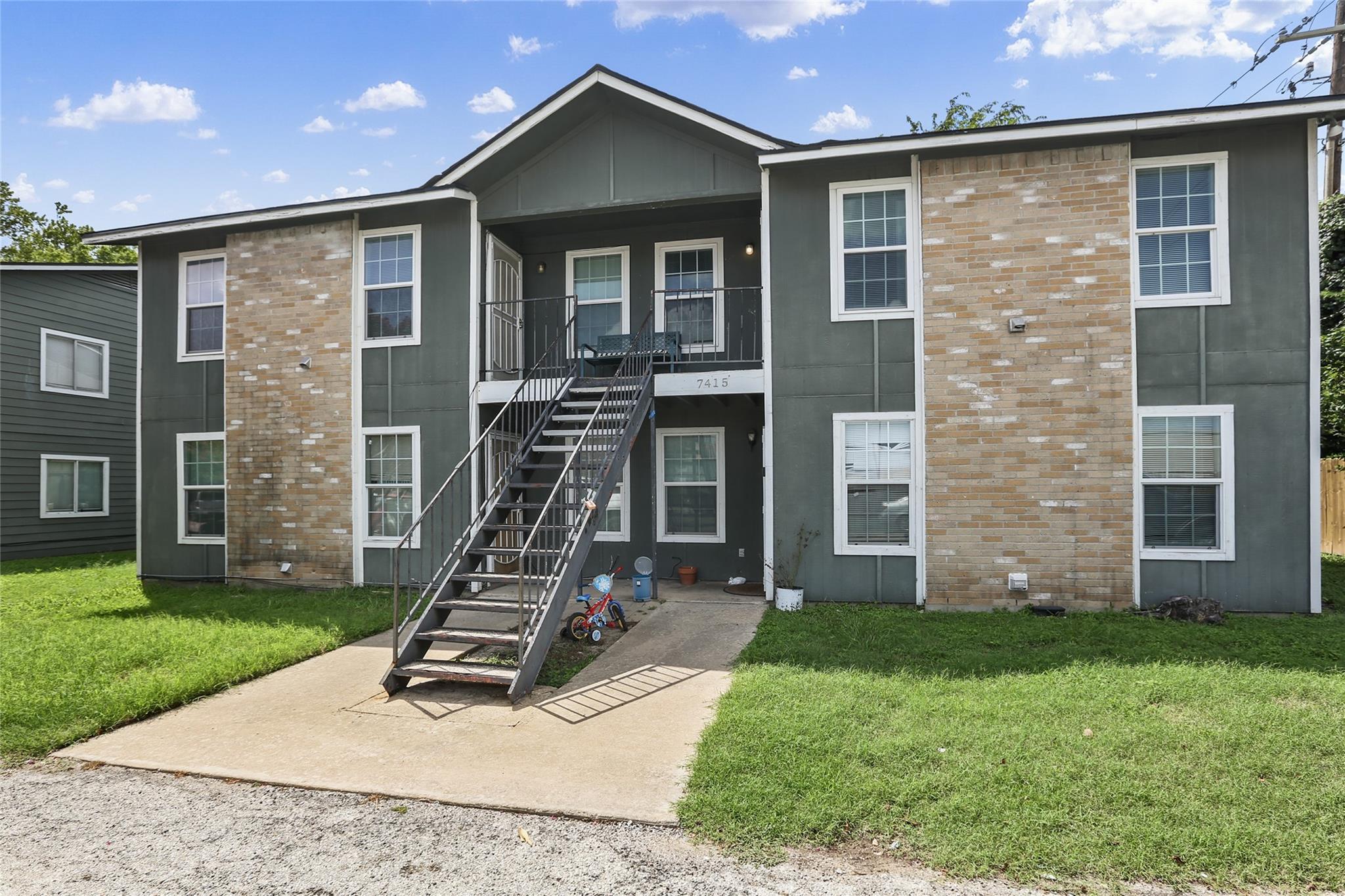 Brick and vertical siding accent the exterior of 