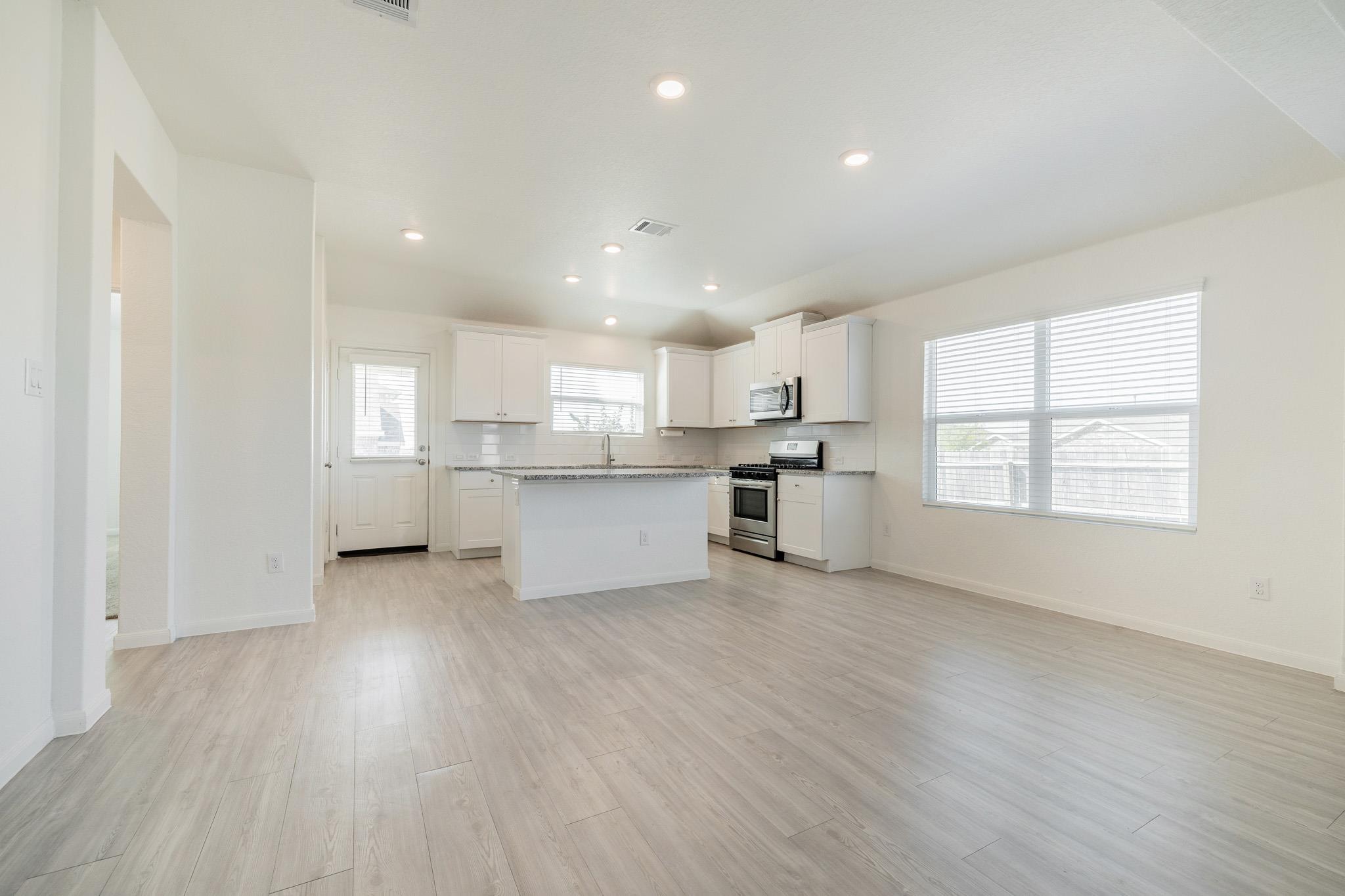 An open floorplan seamlessly connects the casual 