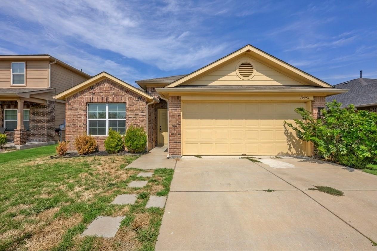 Brick and siding accents create classic curb appe