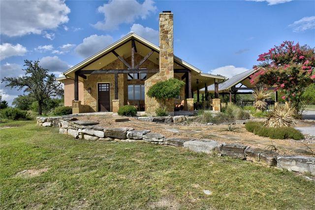 Rustic stone exterior walls support a dramatic va