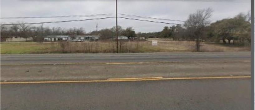 An open cleared lot presents exceptional developm