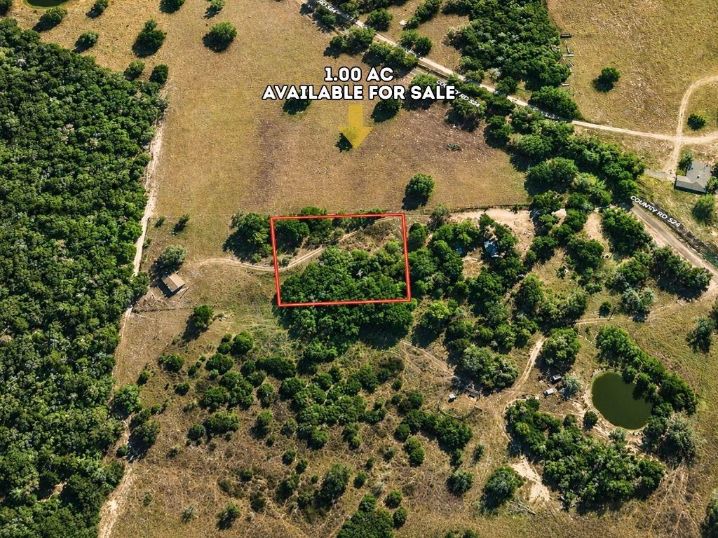 A prime one-acre parcel showcases a mix of open a