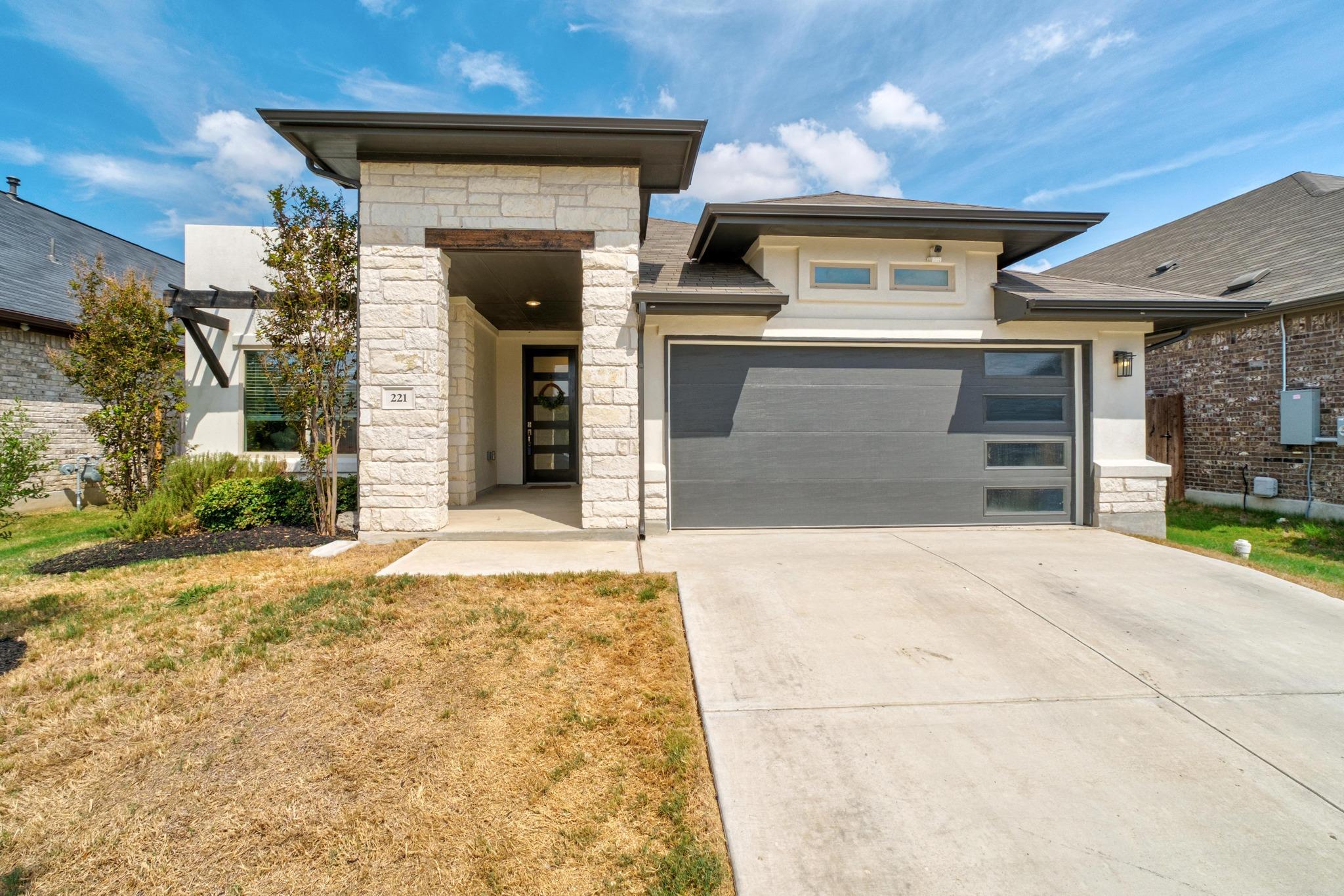 Striking stone accents highlight the contemporary