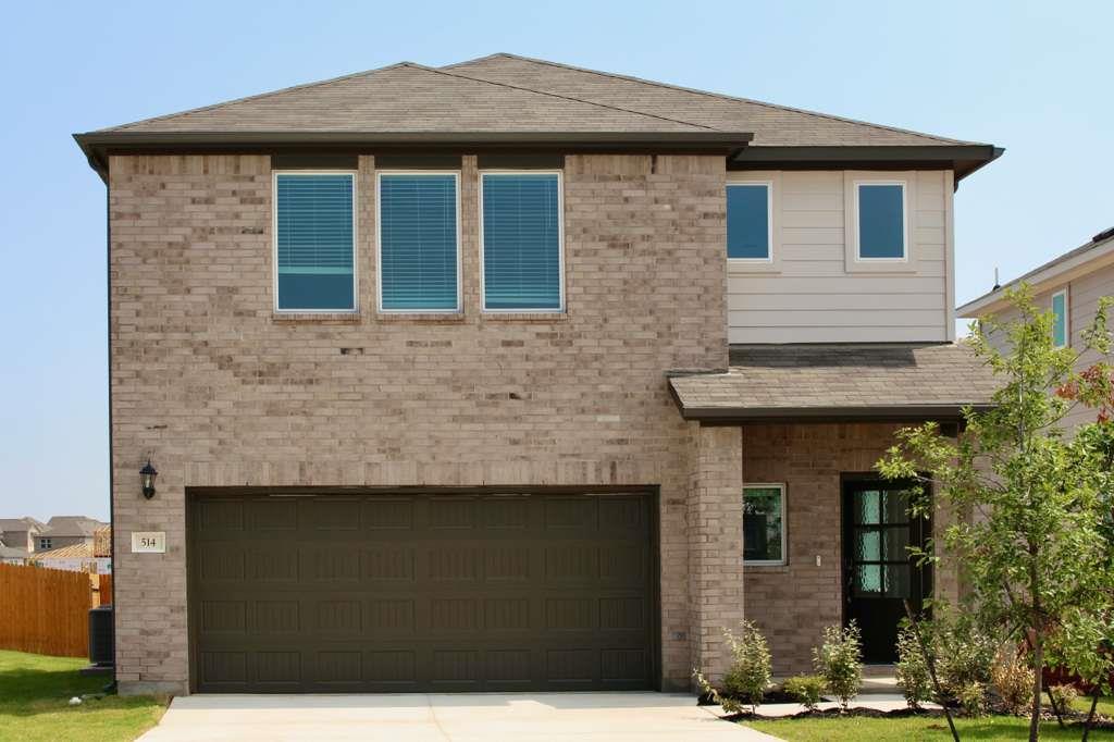 An attractive two-story brick exterior showcases 