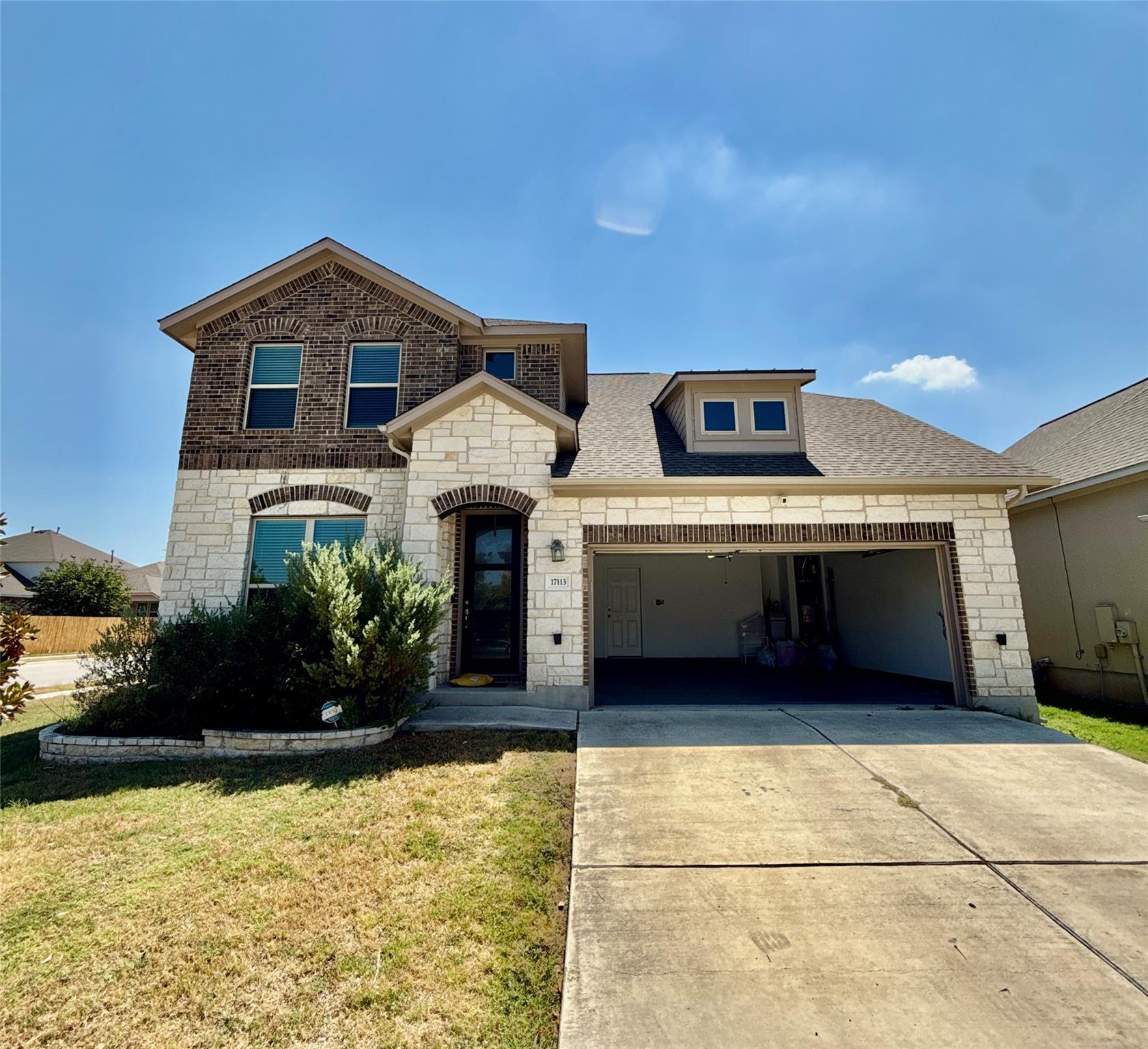 Limestone and brick accents define the exterior o
