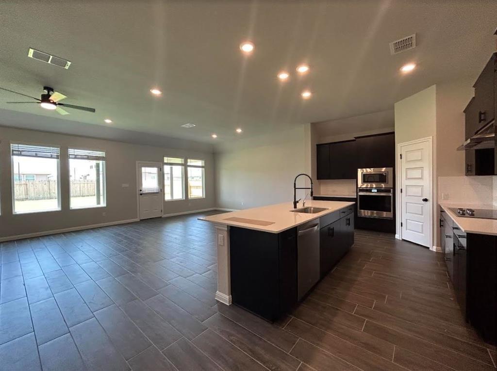 Wood-look tile flooring runs through this airy op