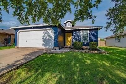 A classic facade features vibrant siding and an i