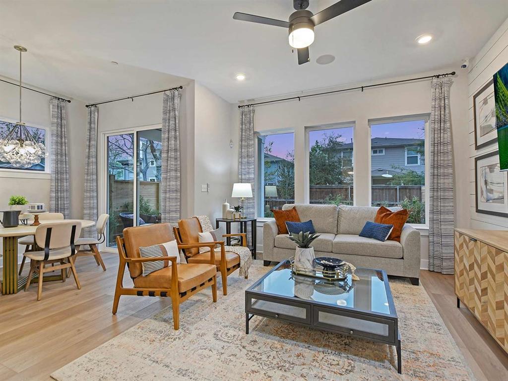 An open living area showcases polished hardwood f