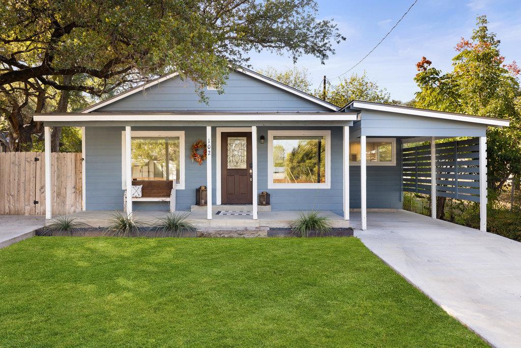 Bungalow-style home featuring a porch, an attache
