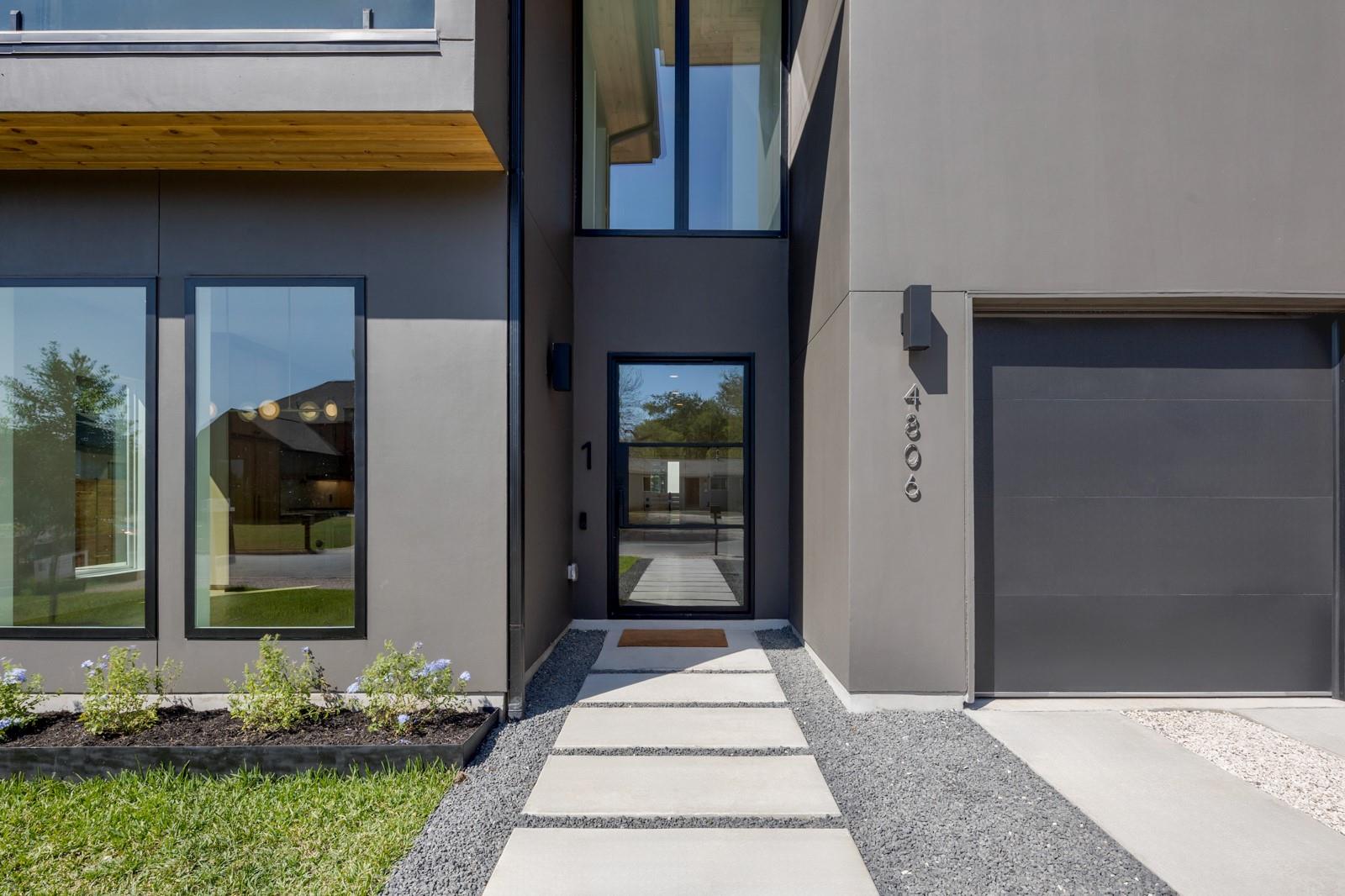 Sleek architectural lines and a modern entry door