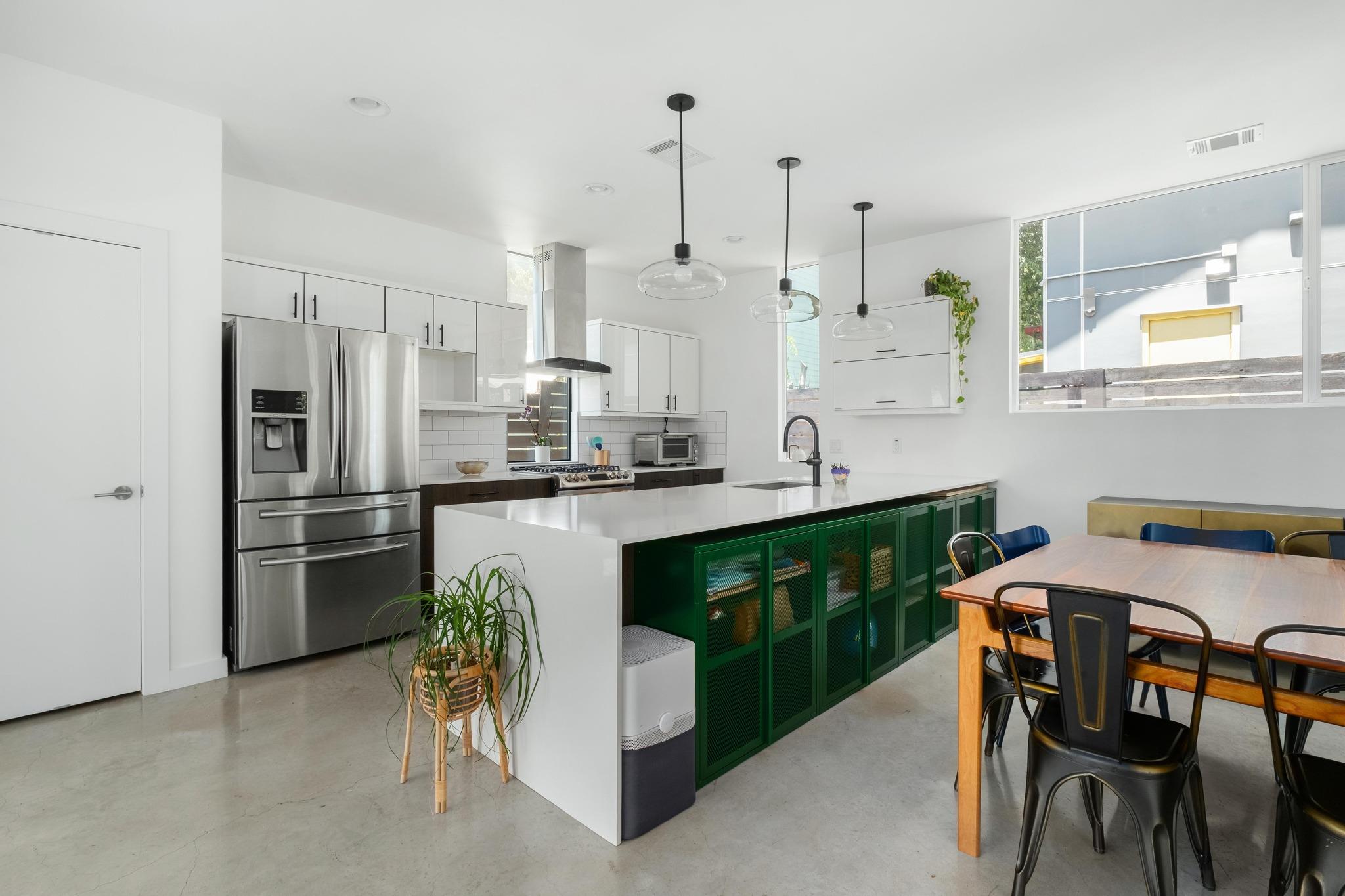 Modern kitchen featuring a large central island w