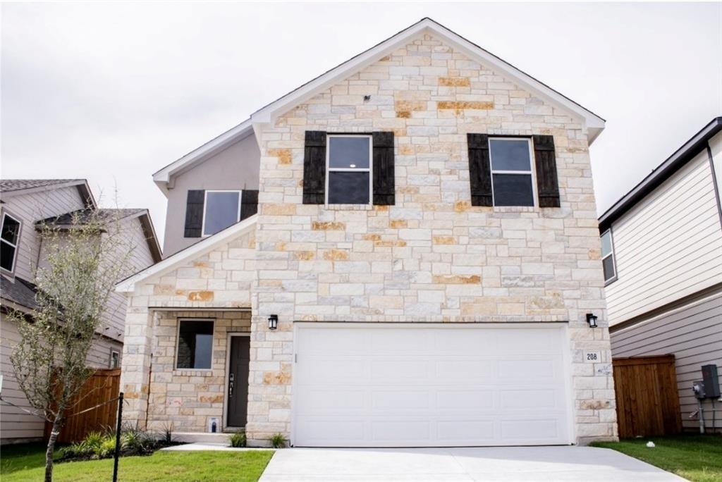 View of front facade featuring an attached garage