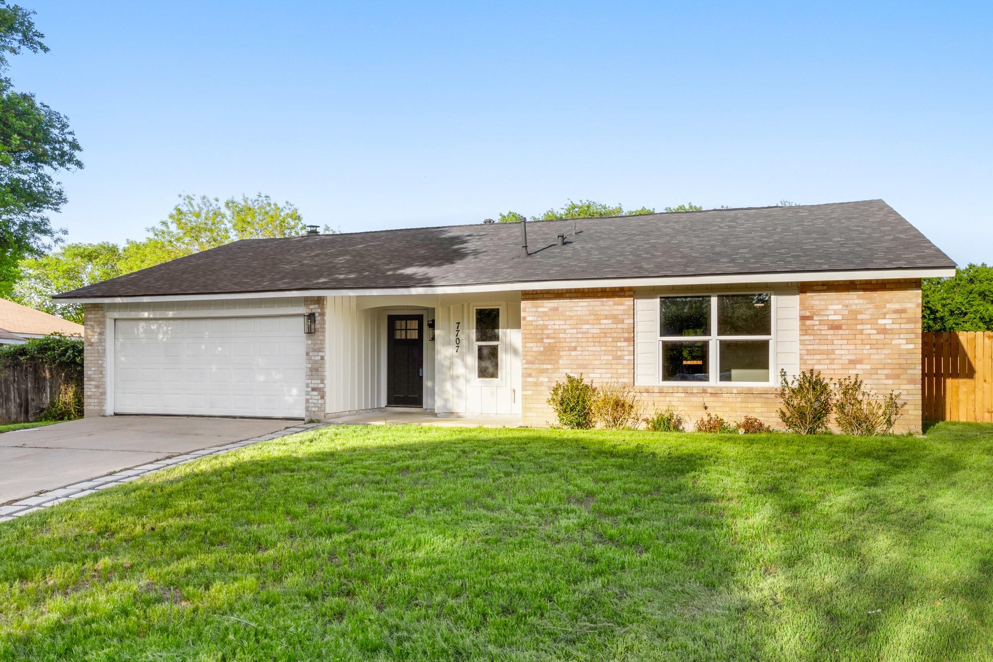 Brick and vertical siding create classic curb app
