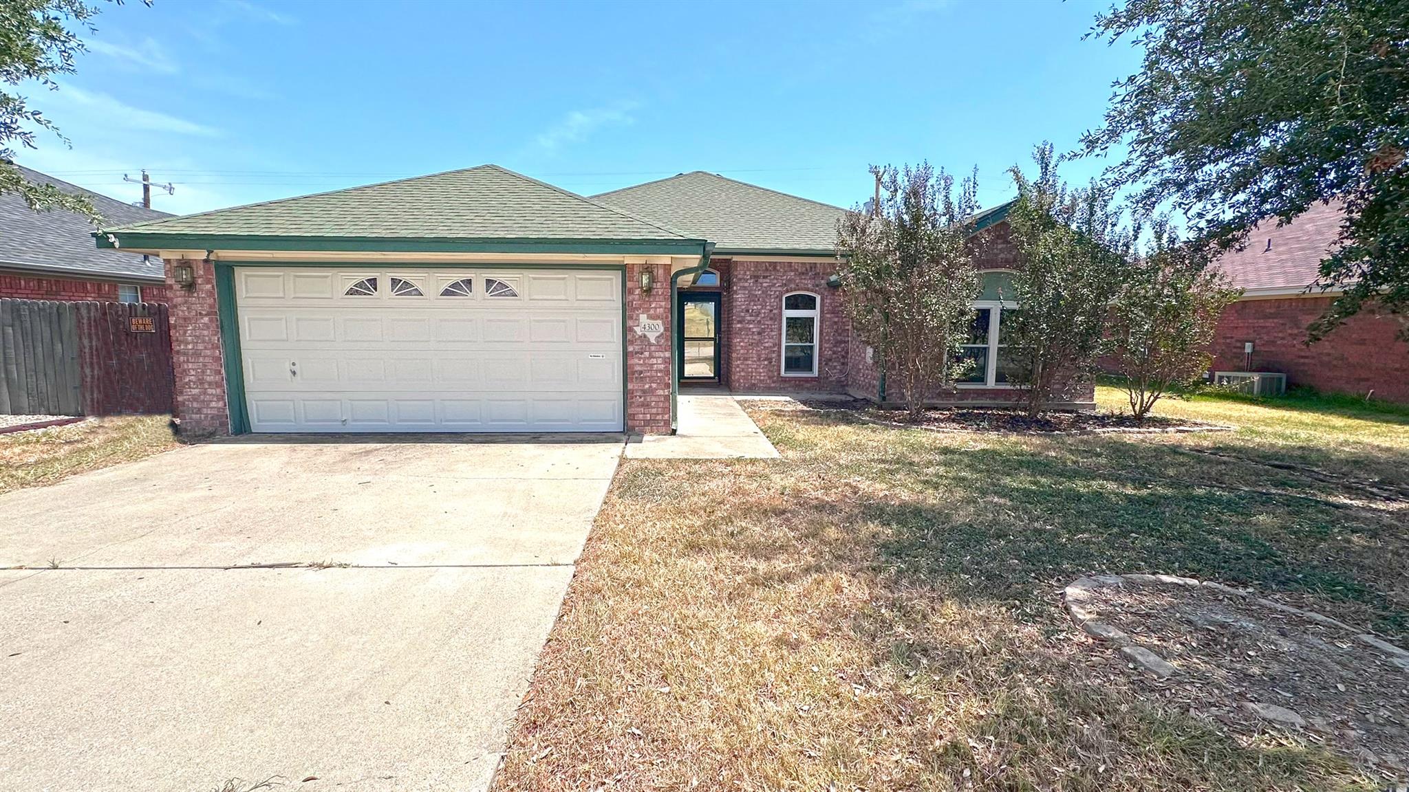 Classic brick exterior accents this single-story 