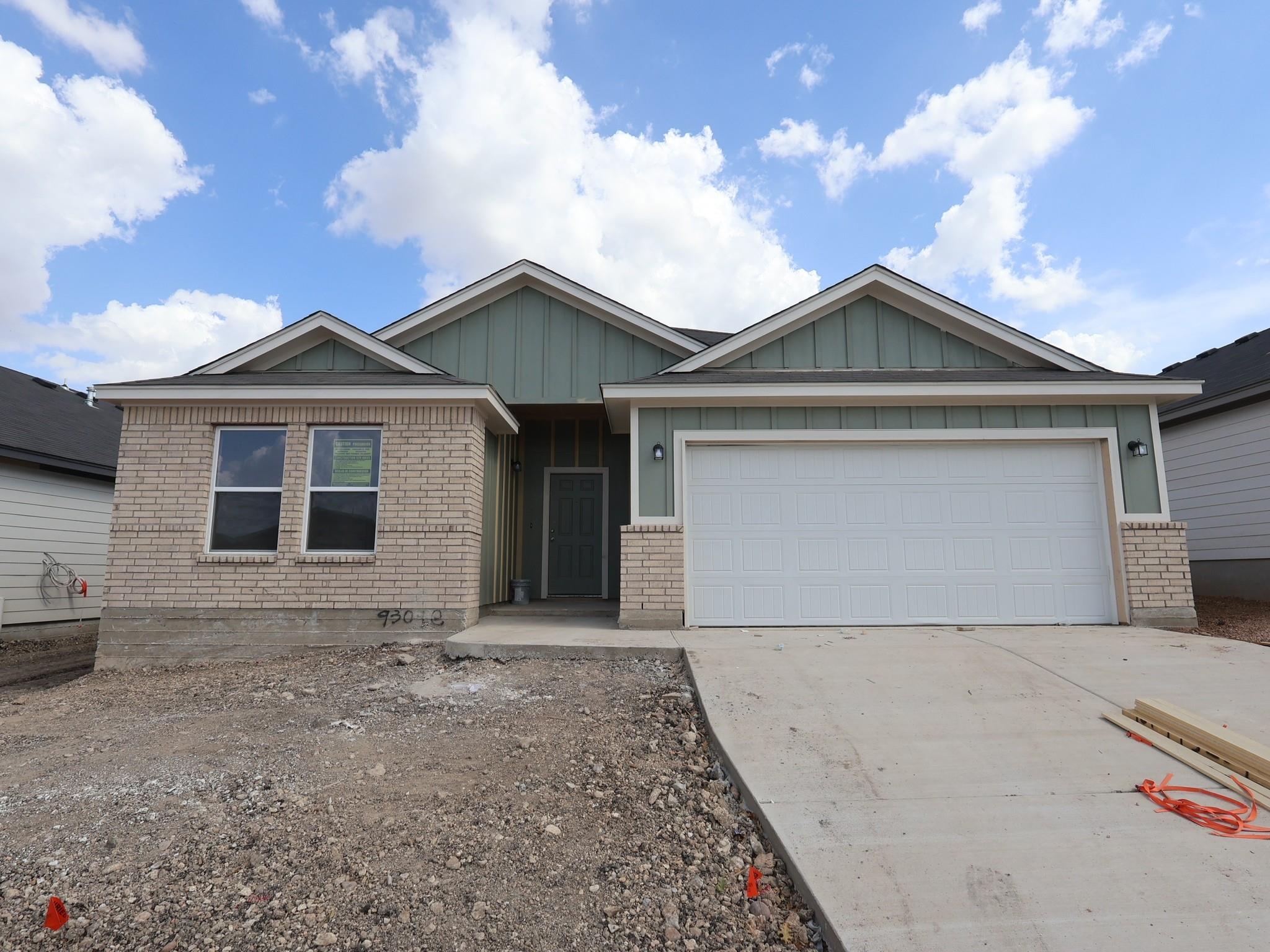 Clean lines and mixed siding textures define this