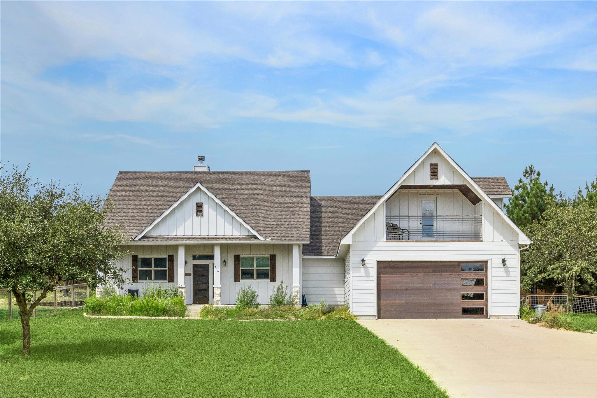 Board and batten siding meets warm wood garage do