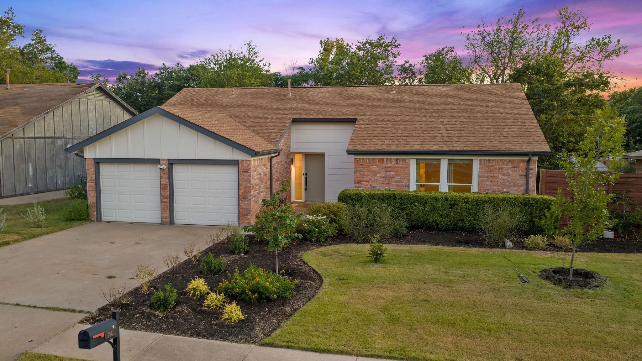 A well-maintained lawn and neat landscaping frame