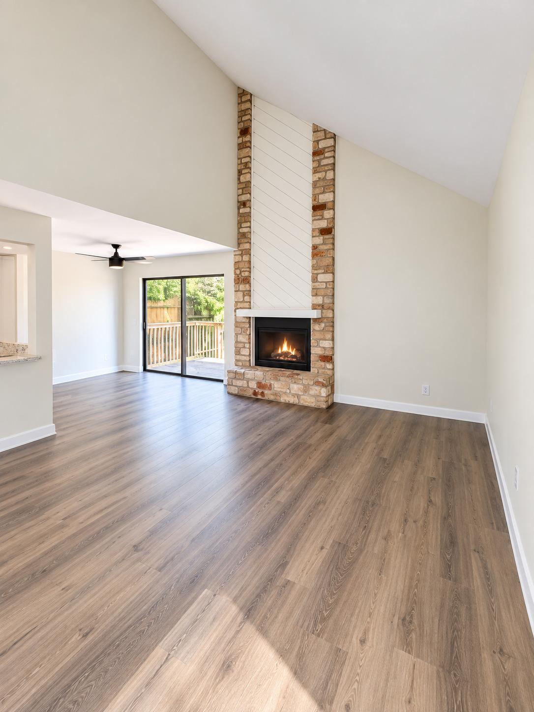 Vaulted ceilings soar over durable wood-look floo