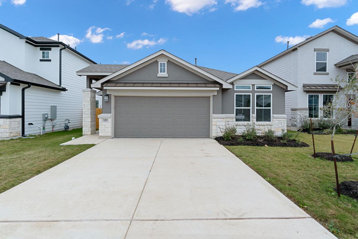 Clean lines and a spacious driveway define this m