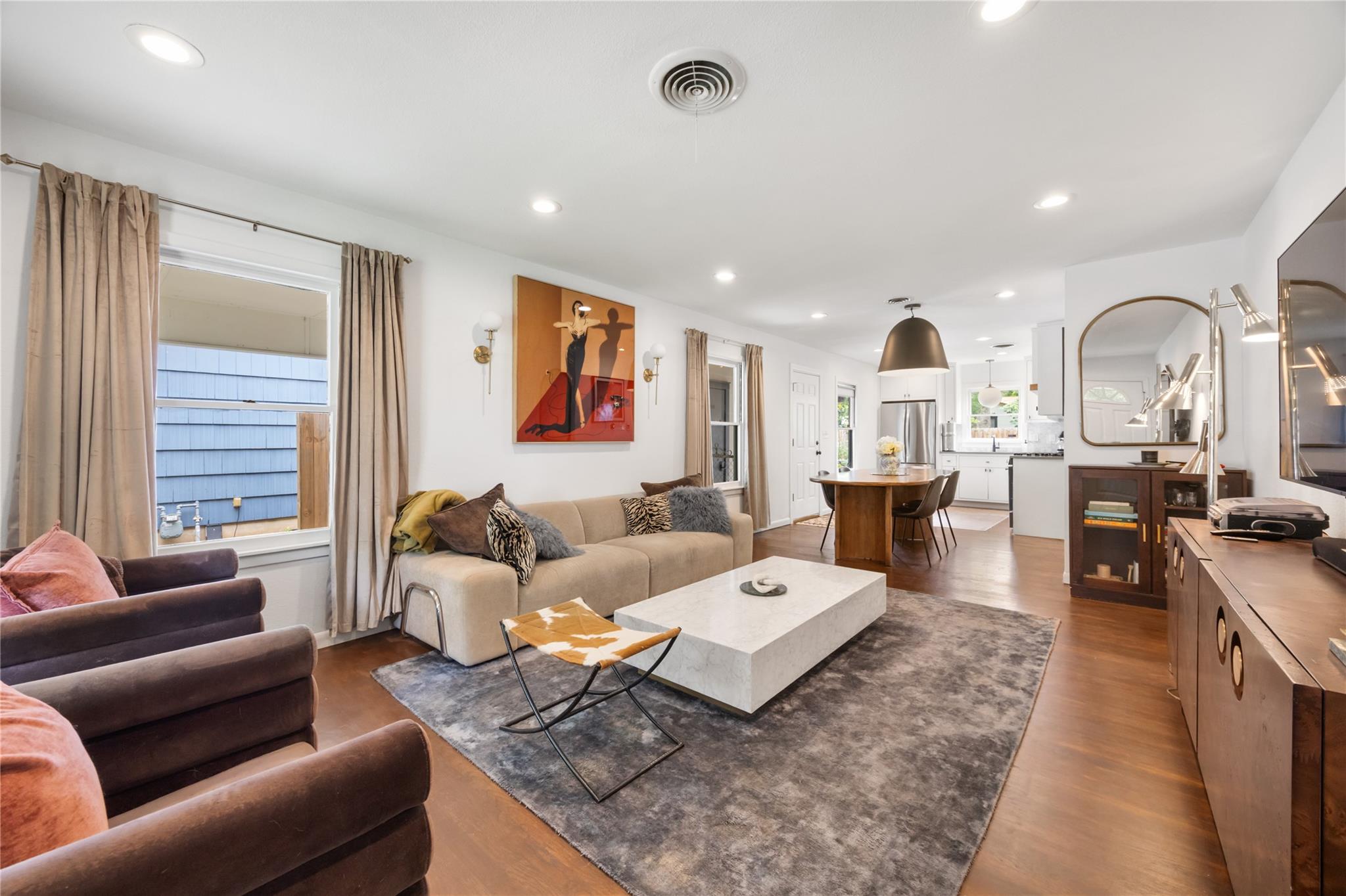 Hardwood floors and recessed lighting enhance thi