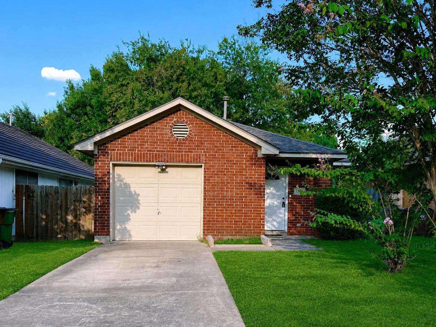 Classic brick exterior framing a single-car garag