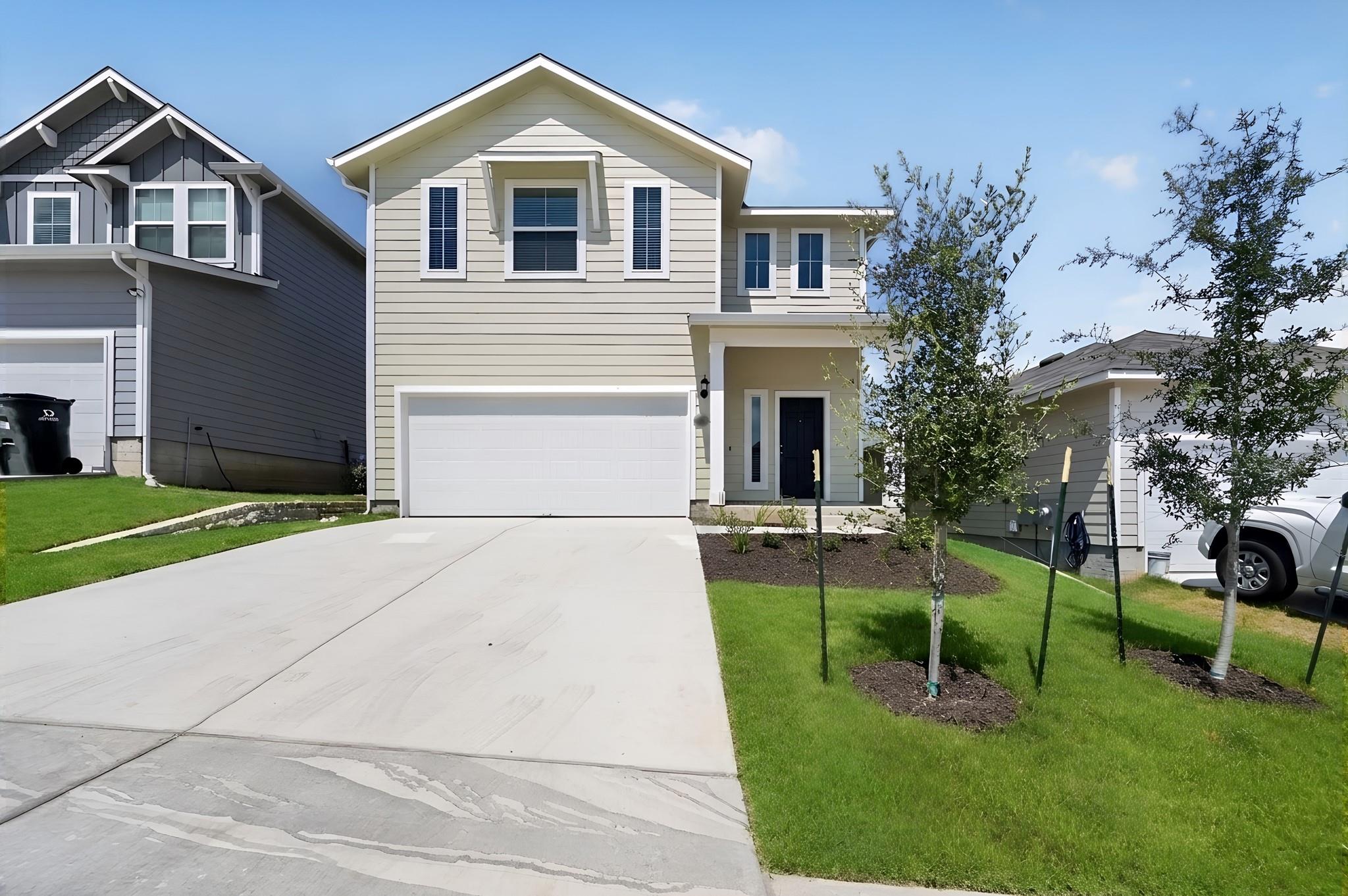 Clean lines and a spacious driveway define this m