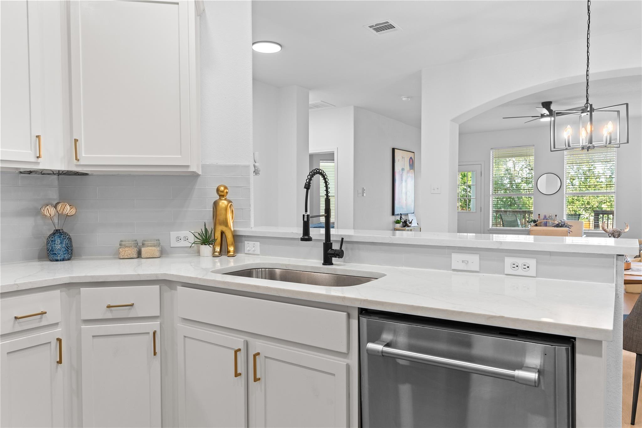 Gleaming stone countertops and modern cabinetry h