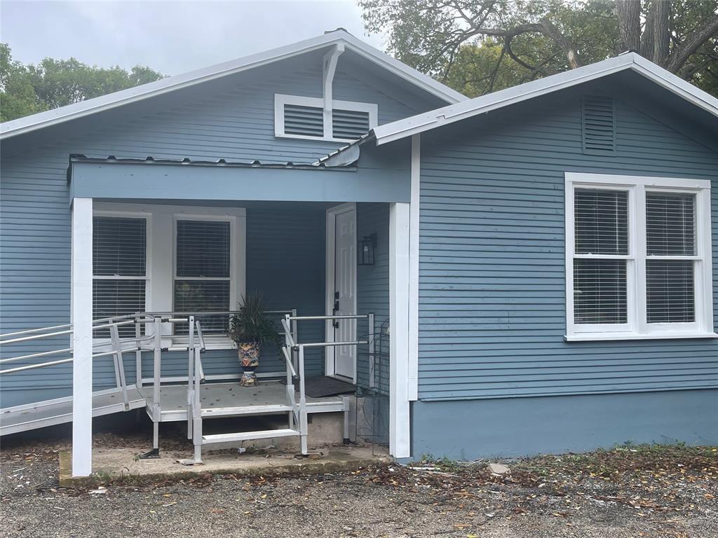 A welcoming front porch with classic siding and c