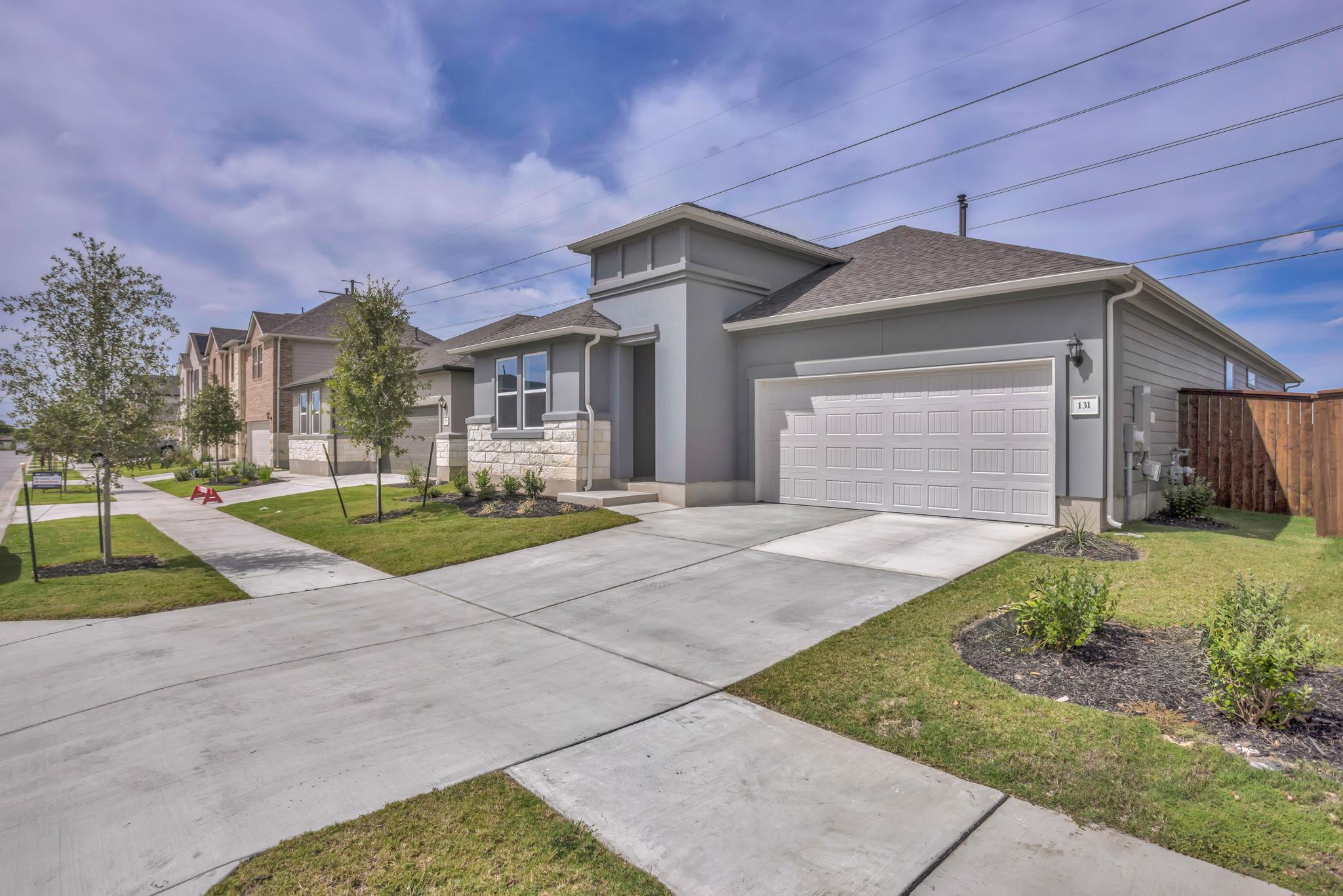 Clean lines and a spacious driveway define this m