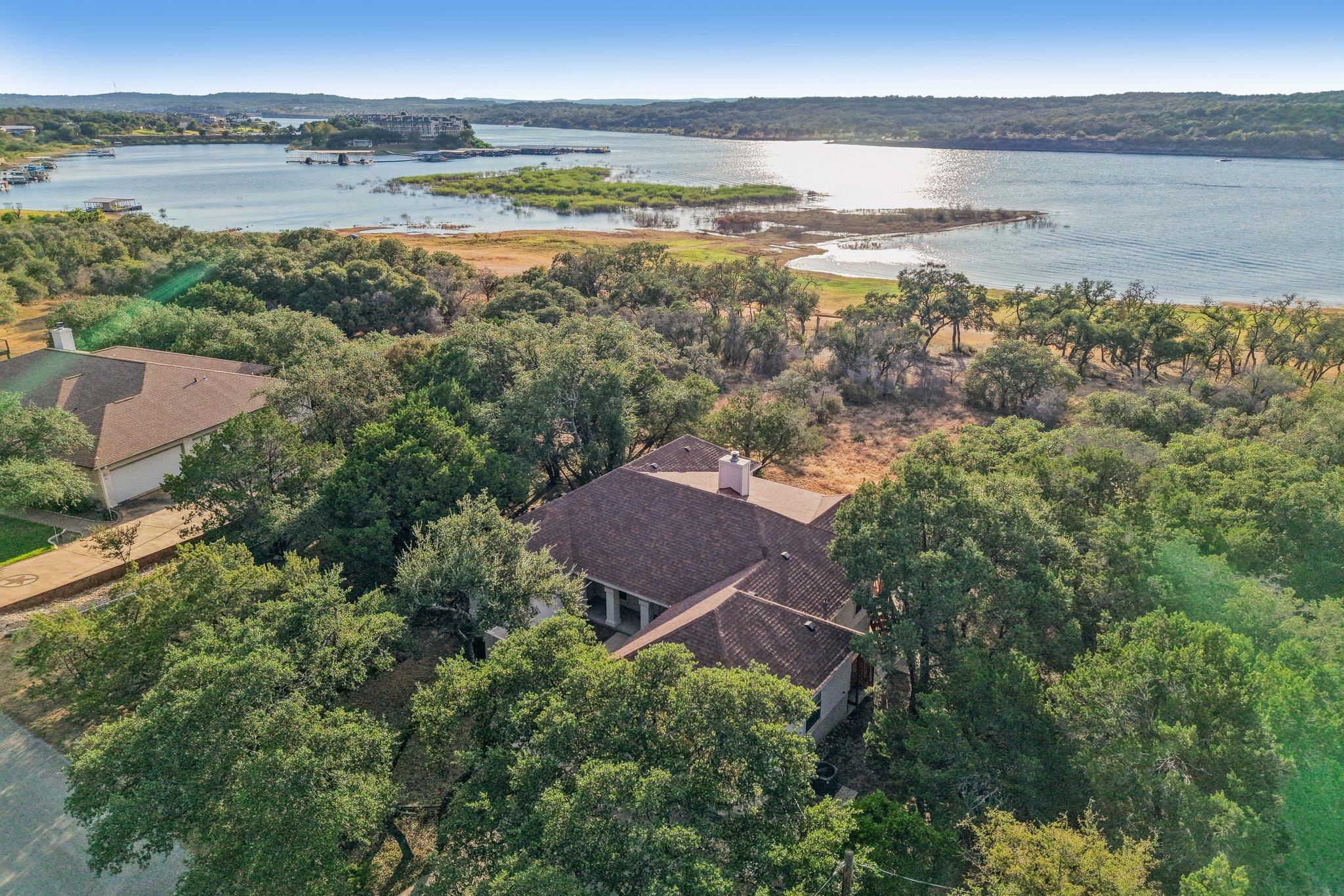 An aerial view showcases a roofline surrounded by