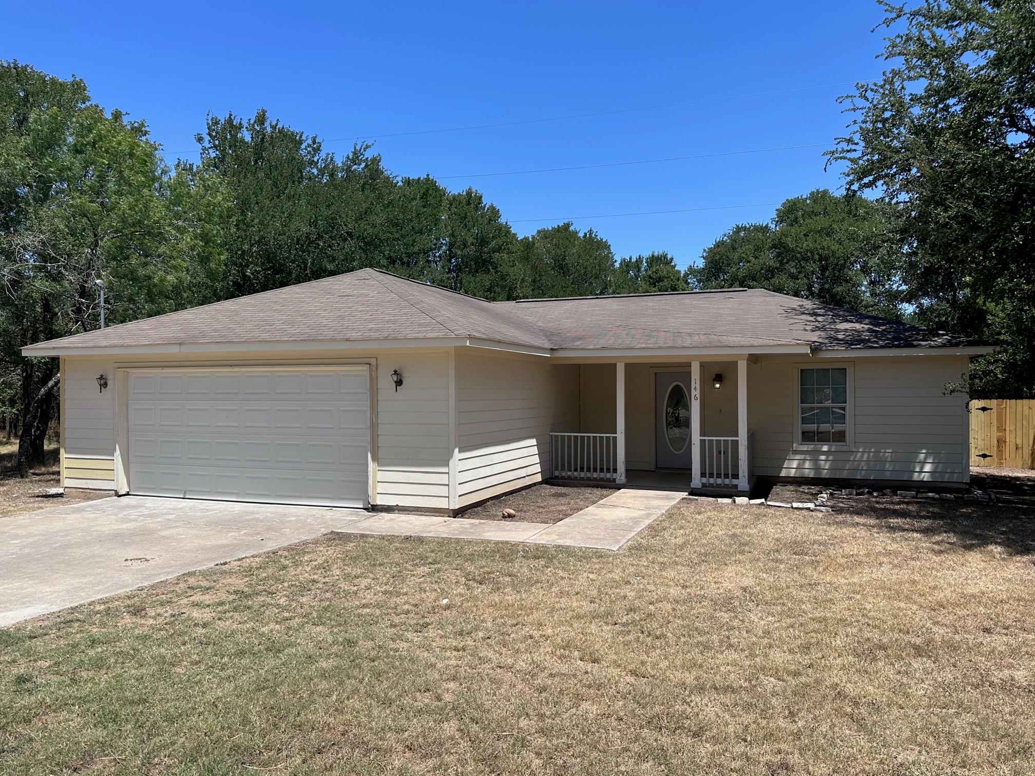 A classic ranch home features siding exterior, a 