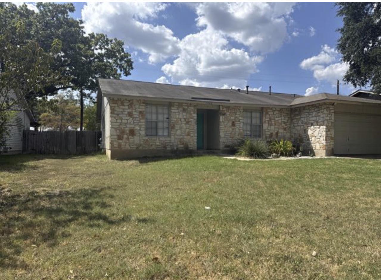 A classic stone exterior defines this single-stor