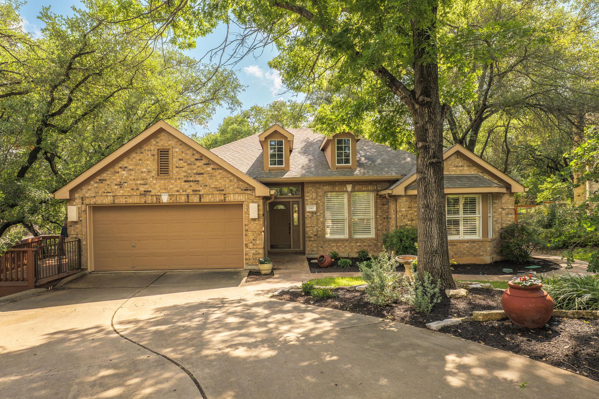 Brick exterior residence featuring a front entry 