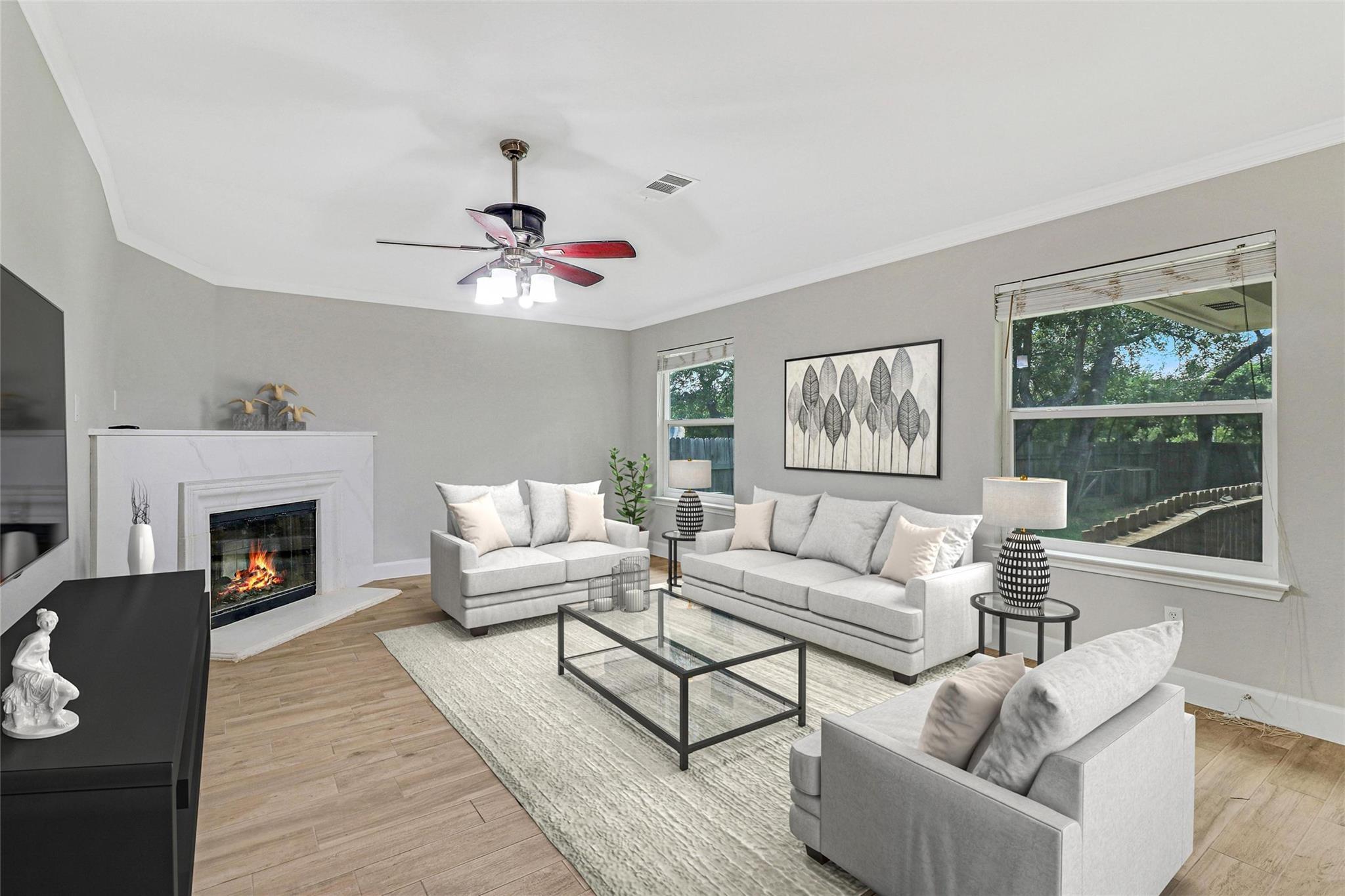 Living room with a glass covered fireplace, crown