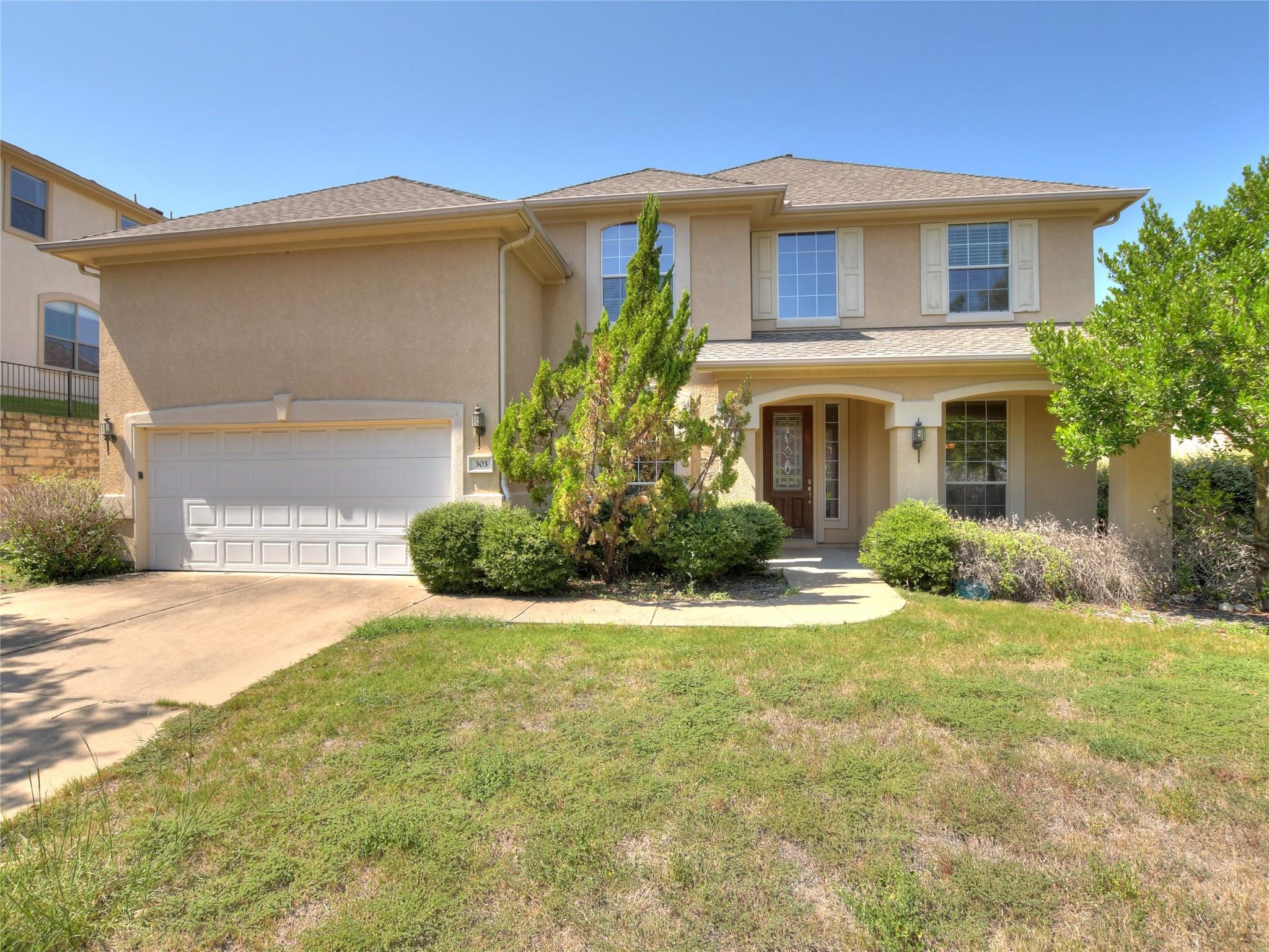 A classic two-story exterior showcases a neutral 