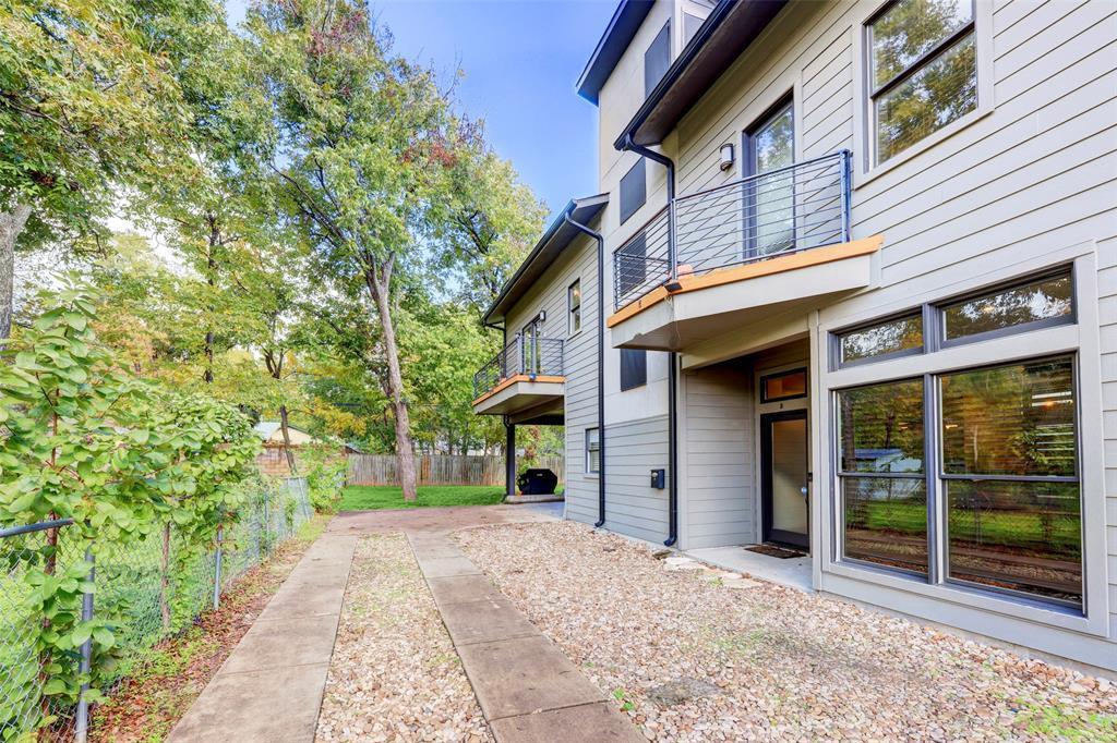 A modern multi-level exterior reveals clean sidin