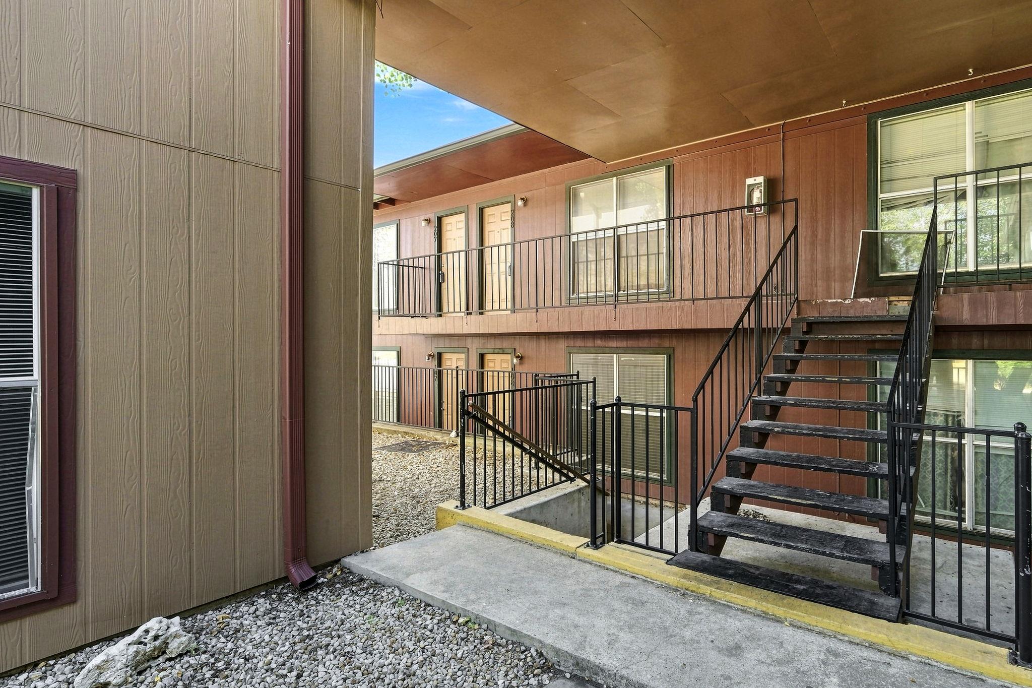 Multi-level outdoor walkways and metal stairs con