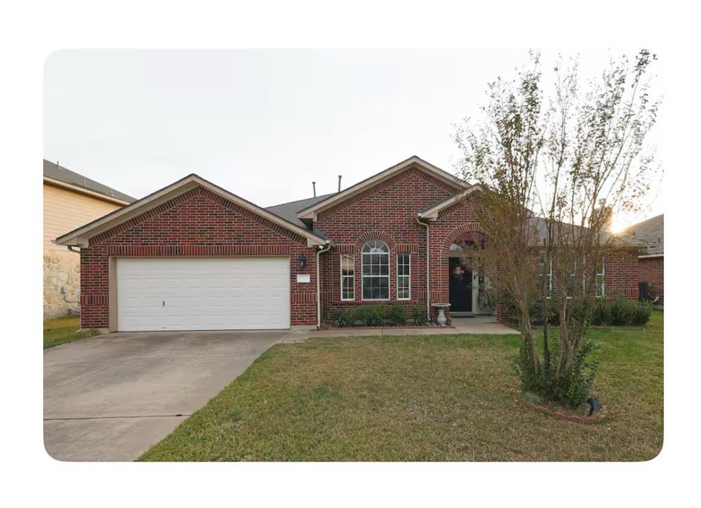 An inviting classic brick elevation pairs with a 