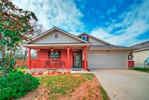 Welcoming front porch and a spacious two-car gara