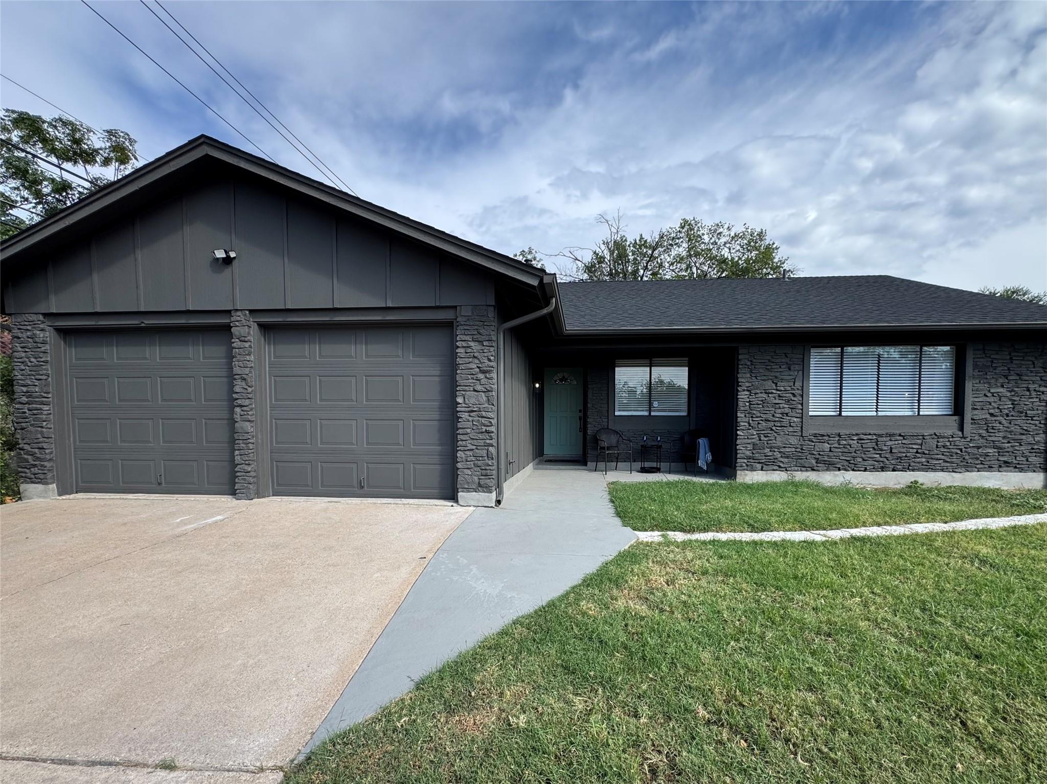A dark stone veneer exterior defines this modern 