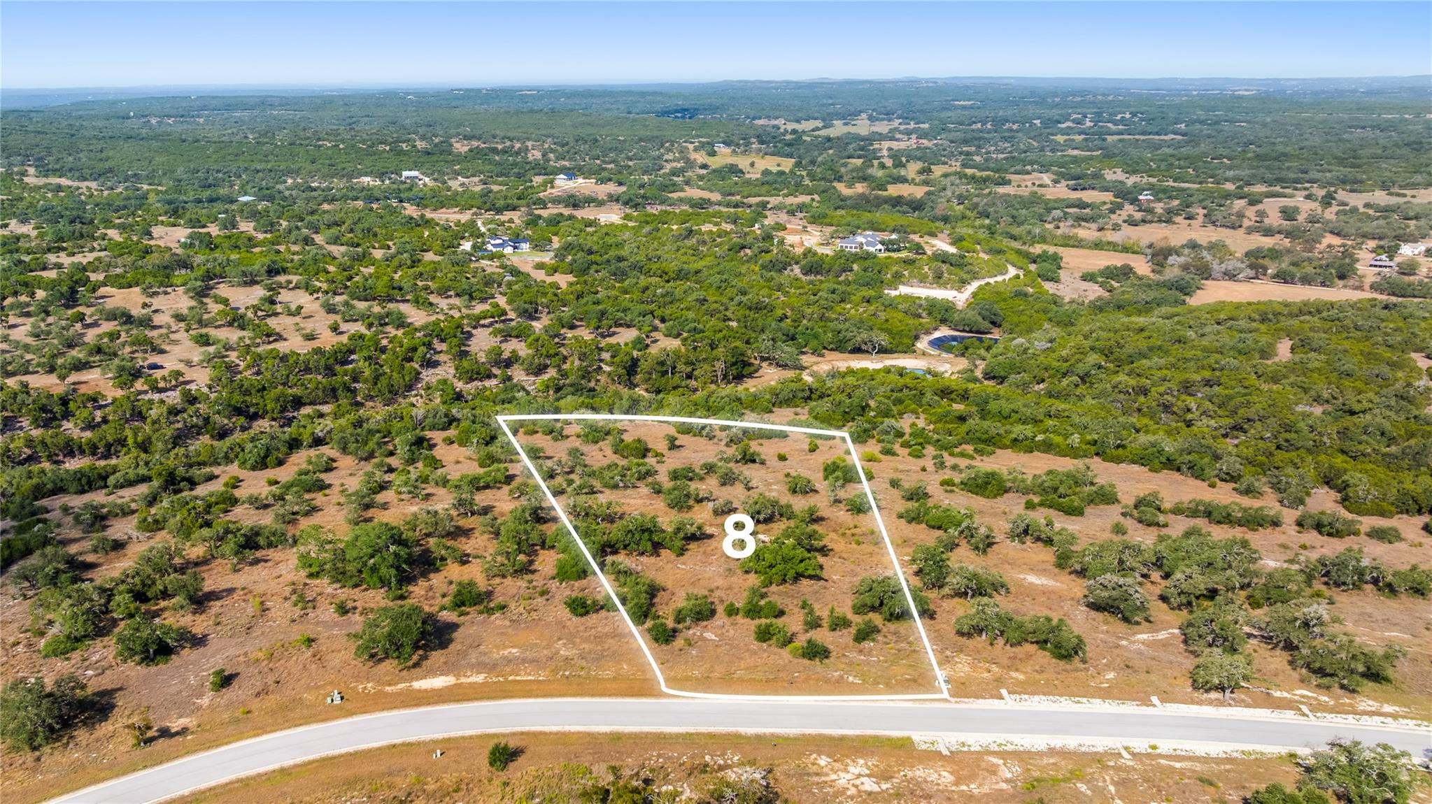 Rolling hills and mature trees define this beauti
